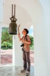 Tourist Man Knock The Metal Bell In Thai Temple Stock Photo