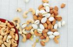 Cashew Nut And Almonds On Tablecloth Stock Photo