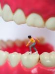 Miniature Teenager Girl Skating On Plastic Teeth Of Removable De Stock Photo