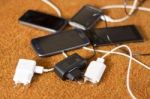 Phone Chargers On The Floor Stock Photo