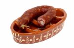 Traditional Portuguese Pottery For Grilling Chorizos Stock Photo