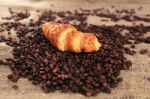 Coffee Beans And Croissant Stock Photo
