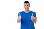 Young Smiling Man Showing Thumbs Up Stock Photo