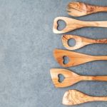 Various Wooden Cooking Utensils Border. Wooden Spoons And Wooden Stock Photo