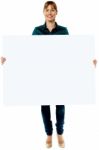 Attractive Woman Holding Blank Ad Board Stock Photo