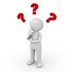 Figure Thinking With Question Marks Stock Photo