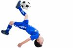Youth Soccer Player Kicking The Ball Stock Photo