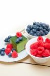 Green Tea Matcha Mousse Cake With Berries Stock Photo