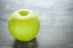 Green Apple On The Table Stock Photo