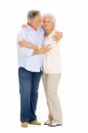 Elderly Couple Enbracing Stock Photo