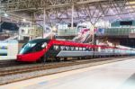 High Speed Train By The Railway Station Stock Photo