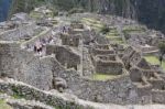 Tourists Exploring Machu Picchu Stock Photo