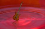 Guitar On Red Water Stock Photo
