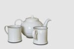 Glass And Kettles Is Made From Ceramic Tile On A White Background With Clipping Path Stock Photo
