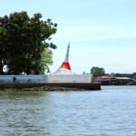 White Slant Pagoda Located At River Side At Koh Kret ,nonthaburi Stock Photo