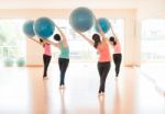 Asian Woman Doing Yoga Indoors Stock Photo