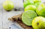 Lime Cut On A Wooden Stock Photo