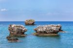 Three Separate Rocks Offshore In Sea Stock Photo