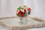 Strawberries With Biscuit Pieces With Mint Whipped Cream Under Stock Photo