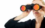 Woman Looking Through Binoculars Stock Photo