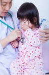Doctor Helps Little Asian Girl Taking Respiratory, Inhalation Therapy Stock Photo
