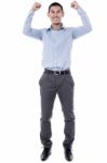 Cheering Young Man Against A White Background Stock Photo