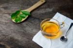 Glass Cup Of Tea And Spoons With Dried Leaves Tea Stock Photo