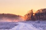 Winter Misty Colorful Sunrise. Rural Foggy And Frosty Scene Stock Photo