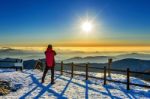Mountaineer Stands On The Peak In Winter,deogyusan National Park In South Korea And Watching To Sunrise. Beautiful Moment The Miracle Of Nature Stock Photo