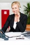 Businesswoman Wearing Headset Stock Photo