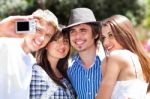 Friends Taking Self Portrait, Outdoors Stock Photo