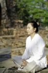 Asian Woman Meditating Yoga Stock Photo