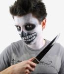 Murderer Skeleton Guy With A Bloody Knife Stock Photo