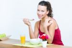 Young Woman Having Breakfast At Home Stock Photo