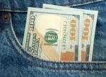 Money In Jeans Pocket Stock Photo