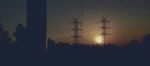 High Voltage Power Tower At Sunset Stock Photo