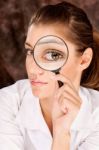 Researcher Looking Through Magnifier Glass Stock Photo