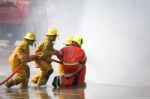 Fireman. Firefighters Fighting Fire During Training Stock Photo