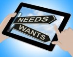 Needs Wants Tablet Means Necessity And Desire Stock Photo