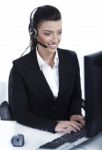 Customer Support Woman With Headset At Office Stock Photo