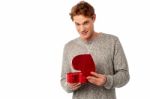 Young Smiling Guy Holding Gift Box Stock Photo