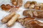 Bread And Cookies In Cellophane Bags Stock Photo