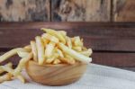 French Fries On Wooden Stock Photo