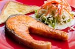 Salmon Steak With Salad And Bread Stock Photo