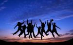 Crowd Of Friends Jumping On Blue Sky Background Stock Photo