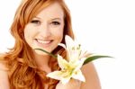 Beauty Woman Holding Lily Flower Stock Photo