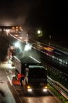 Road Works, Removal Of Old Asphalt Pavement At Night Stock Photo