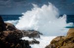 Waves Pounding The Coastline At Capo Testa Stock Photo