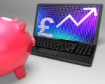 Pound Symbol On Laptop Showing Britain Increases Stock Photo