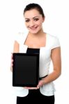 Pretty Young Girl Showcasing A Tablet Device Stock Photo